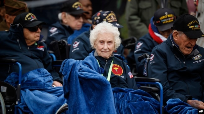 U.S war veterans attend a ceremony to mark the 79th anniversary of the assault that led to the liberation of France and Western Europe from Nazi control, at the American Cemetery in Colleville-sur-Mer, Normandy, France, Tuesday, June 6, 2023. The American Cemetery is home to the graves of 9,386 United States soldiers. Most of them lost their lives in the D-Day landings and ensuing operations. (AP Photo/Thomas Padilla)