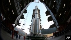 The Long March 3B rocket carrying the Chang'e-3 lunar probe is prepared for launch at the Xichang Satellite Launch Center in Xichang in southwest China's Sichuan province on Sunday, Dec. 1, 2013. 