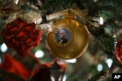 An ornament with an image of President George Washington is seen during the 2018 Christmas preview at the White House in Washington, Monday, Nov. 26, 2018. (AP Photo/Carolyn Kaster)