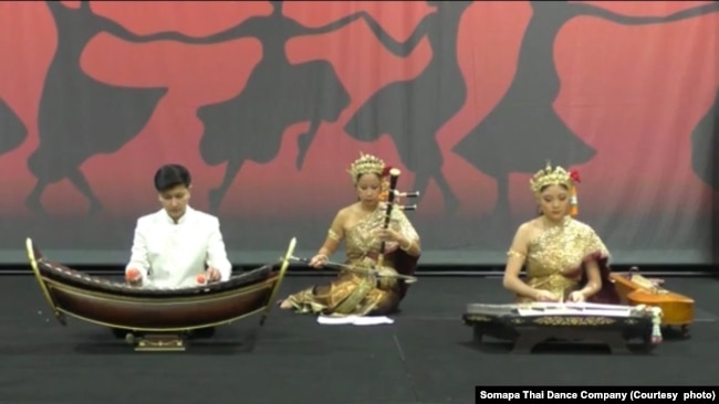 A co-founder and a performer of the Somapa Thai Dance Company, Suteera Nagavajara (center) performs the Thai classical song - Mayura Pirom or Dance of a Peacock during the DC Travel Show event at the Washington Convention Center, Washington, DC. March 17,