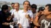 Indonesian presidential candidate Joko Widodo talks to the media during his visit at a reservoir development project in Jakarta, Indonesia, July 22, 2014.