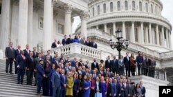 Newly-elected members of Congress pose for a class photo on the East Front of the Capitol in Washington, Nov. 15, 2022. 