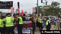 First clash with police - stopped counter-protestors because of picket signs