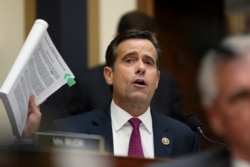FILE - Republican Congressman John Ratcliffe poses questions to former special counsel Robert Mueller, as he testifies before the House Judiciary Committee on his report on Russian election interference, on Capitol Hill, in Washington, July 24, 2019.