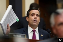 FILE - Republican Congressman John Ratcliffe poses questions to former special counsel Robert Mueller, as he testifies before the House Judiciary Committee on his report on Russian election interference, on Capitol Hill, in Washington, July 24, 2019.