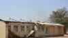 This Tuesday, Feb. 25, 2014, photo, shows the remains of the burned out Federal Government College in Buni Yadi, Nigeria. Islamic militants killed dozens of students in a pre-dawn attack Tuesday on the northeast Nigerian school, survivors said, setting