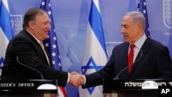 U.S. Secretary of State Mike Pompeo and Israeli Prime Minister Benjamin Netanyahu shake hands as they deliver joint statements during their meeting in Jerusalem, March 20, 2019.