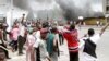 Nouvelles violences meurtrières à Kinshasa où plusieurs sièges de partis d'opposition ont été incendiés