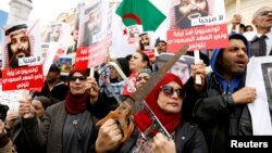 Tunisians take part in a protest, opposing the visit of Saudi Arabia's Crown Prince Mohammed bin Salman in Tunis, Tunisia, Nov. 27, 2018.