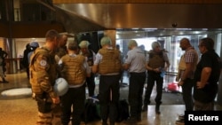 French gendarmes prepare forensic supplies in the lobby of the Radisson hotel in Bamako, Mali, November 20, 2015. 