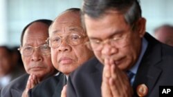 Chea Sim, center, president of the ruling Cambodian People's Party, Heng Samring, rear left, the party honorary president, Hun Sen, foreground, the party's vice president and the prime minister of the Cambodian government.