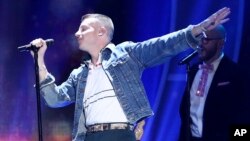 Macklemore performs at the 2017 iHeartRadio Music Festival in Las Vegas, Sept. 23, 2017. The U.S. rapper will sing his marriage equality anthem "Same Love" during a weekend football grand final in Sydney, Australia on Sunday.