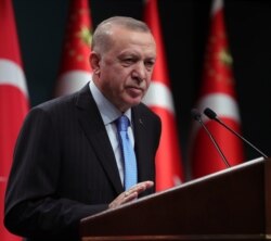 FILE - Turkey's President Recep Tayyip Erdogan speaks to reporters following a Cabinet meeting, in Ankara, Turkey, Jan. 11, 2021.