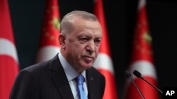 File - Turkey's President Recep Tayyip Erdogan speaks to reporters following a Cabinet meeting, in Ankara, Turkey, Jan. 11, 2021, saying Turkey and Greece will resume talks aimed at reducing tensions between the neighbors on Jan. 25. 