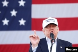 FILE - Republican presidential nominee Donald Trump holds a campaign event in Miami, Florida, Nov. 2, 2016.