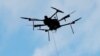 An Airspace Systems Interceptor autonomous aerial drone releases a kevlar net to capture a simulated hostile drone during a product demonstration in Castro Valley, California, March 6, 2017.