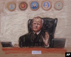 FILE - A Pentagon-approved sketch by court artist Janet Hamlin shows Army Col. James Pohl, the judge in proceeding, as he halts the Sept. 11 pretrial hearing at the Guantanamo Bay U.S. Naval Base in Cuba, April 17, 2014.