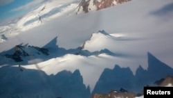 Jagged mountains throw long shadows on the Antarctic peninsula Jan. 20, 2009.
