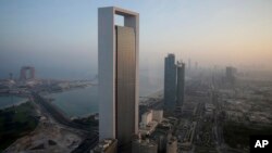 The sun rise over the Abu Dhabi skyline, United Arab Emirates, Nov. 7, 2016.