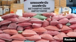 FILE - Bags of methamphetamine pills are pictured during the 50th Destruction of Confiscated Narcotics ceremony in Ayutthaya province, Thailand, June 26, 2020.