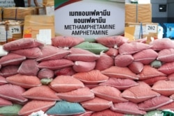 FILE - Bags of methamphetamine pills are pictured during the 50th Destruction of Confiscated Narcotics ceremony in Ayutthaya province, Thailand, June 26, 2020.