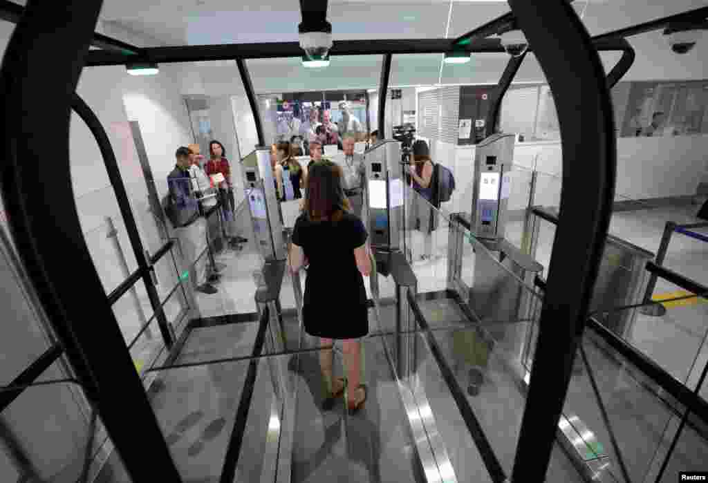 A passenger enters an airlock for facial recognition at Nice international airport&#39;s immigration section in Nice, France.