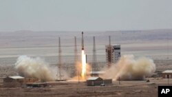 This photo, released by the official website of the Iranian Defense Ministry, July 27, 2017, claims to show the launching of Simorgh satellite-carrying rocket in an undisclosed location in Iran.