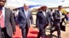 Israeli Prime Minister Benjamin Netanyahu (L) walks with Uganda's President Yoweri Museveni (R) after arriving to commemorate the 40th anniversary of Operation Entebbe at the Entebbe airport in Uganda, July 4, 2016.