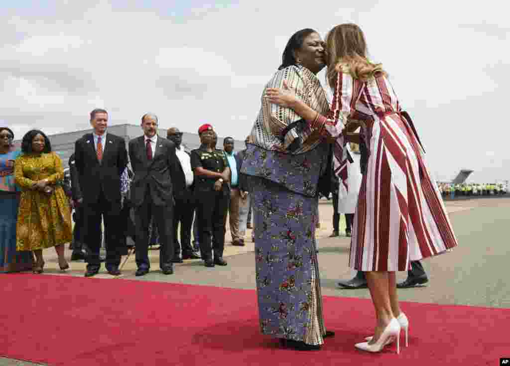First lady Melania Trump is greeted by Ghana's first lady Rebecca Akufo-Addo as she arrives at Kotoka International Airport in Accra, Ghana, Oct. 2, 2018. 