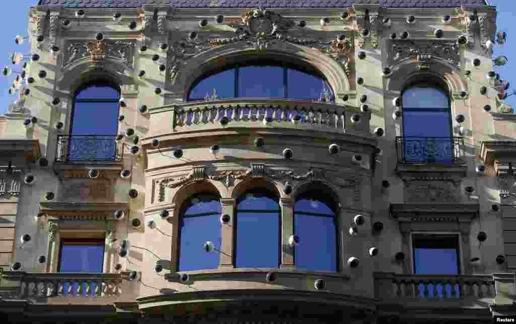 Eye-shaped decorations are seen on the main facade of a former police station, now used as a hotel, in Barcelona, Spain. Spain said it was beefing up security around key infrastructure after Wednesday&#39;s armed attack on French magazine Charlie Hebdo in Paris.