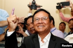 FILE - Kem Sokha, president of the opposition Cambodia National Rescue Party, casts his vote during local elections in Kandal province, Cambodia, June 4, 2017. Kem Sokha was charged with treason in early September, accused of colluding with a foreign entity to undermine the government.