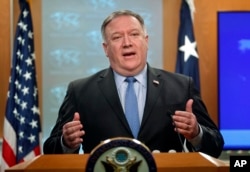 FILE - Secretary of State Mike Pompeo gestures while speaking during a news conference at the State Department in Washington, Nov. 20, 2018.