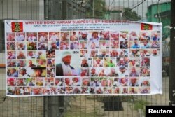 FILE - A poster displaying wanted Boko Haram suspects is seen on a street in Yenagoa in Nigeria's delta region, May 19, 2016.