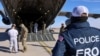 Migrants are checked before they board a U.S. military aircraft in Fort Bliss, Texas, headed to a detention facility at Guantanamo Bay, Cuba, Feb, 4, 2025. (U.S. Department of Homeland Security handout via Reuters)