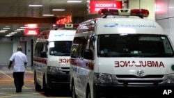 Ambulances are parked outside the accident and emergency entrance at Mount Elizabeth Hospital in Singapore, Dec. 28, 2012. 