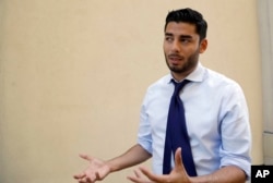 Democratic congressional candidate Ammar Campa-Najjar speaks during an interview, Aug. 22, 2018, in San Diego. Campa-Najjar, 29, has never held elective office but worked in the Obama administration Labor Department. He won second place in the state’s primary where the top-two vote-getters advance to the general election regardless of party.