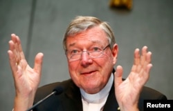 FILE - Cardinal George Pell talks during a news conference at the Vatican July 9, 2014.