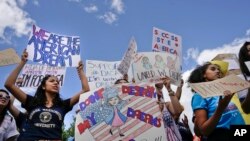 Supporters of Deferred Action for Childhood Arrival program (DACA) demonstrate in front of the White House, Sept. 9, 2017.