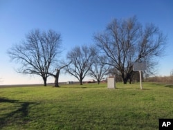 A sign, right, in a field in Clarksdale, Miss., marks the site of the Stovall Plantation, where Muddy Waters' songs were recorded in 1941 by musicologist Alan Lomax as he collected folk music for the Library of Congress.