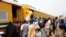 FILE - Passengers rush to board train enroute Lagos-Kano at Mokwa Station on February 8, 2013.