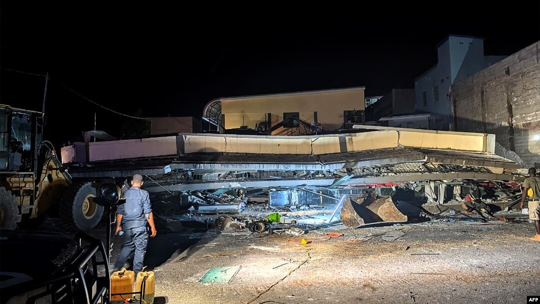 Rescue workers are seen at the site of a collapsed building after an earthquake struck Port Vila, the capital city of Vanuatu, on Dec. 18, 2024.