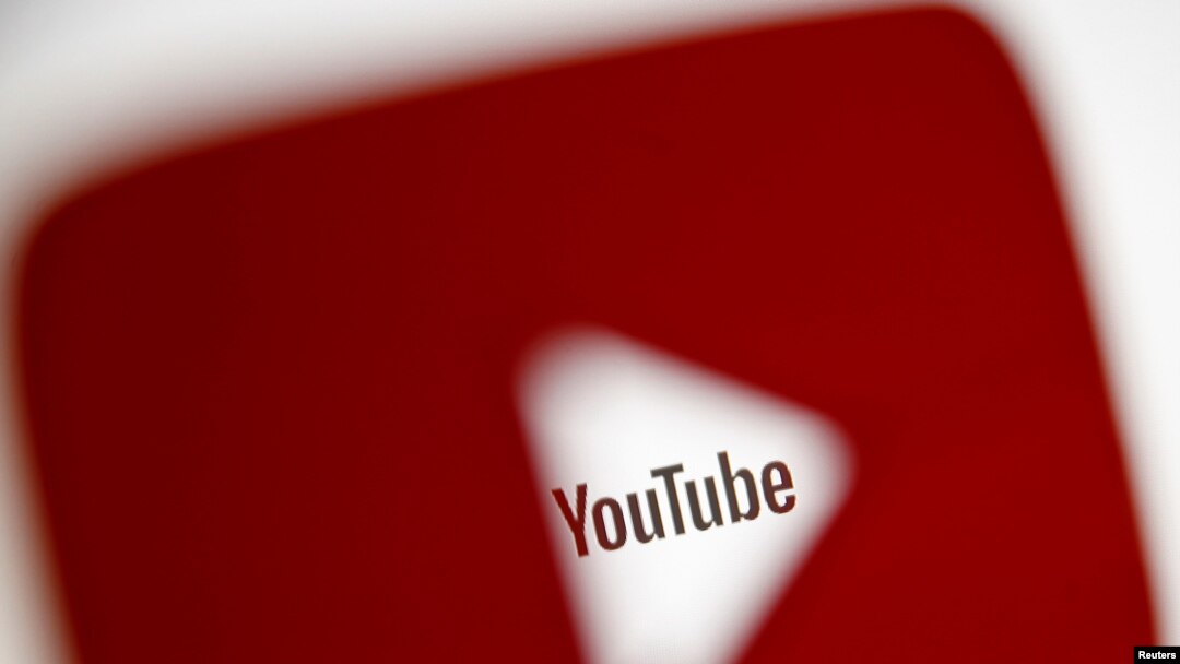 FILE - A 3-D-printed YouTube icon is seen in front of a displayed YouTube logo in this illustration taken Oct. 25, 2017. 