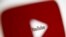 FILE - A 3-D-printed YouTube icon is seen in front of a displayed YouTube logo in this illustration taken Oct. 25, 2017. 