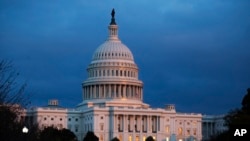 FILE - In this Nov. 12, 2019, file photo, the U.S. Capitol is seen as the sun sets in Washington.