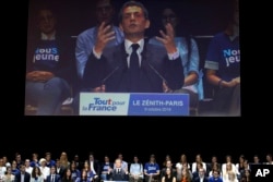 Former French President Nicolas Sarkozy is seen on a large screen during his speech as he runs for the 2017 presidential election in Paris, France, Oct. 9, 2016.