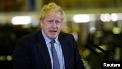 Britain's Prime Minister Boris Johnson speaks as he visits an electric car plant in Warwickshire, Britain, Nov. 13, 2019. 