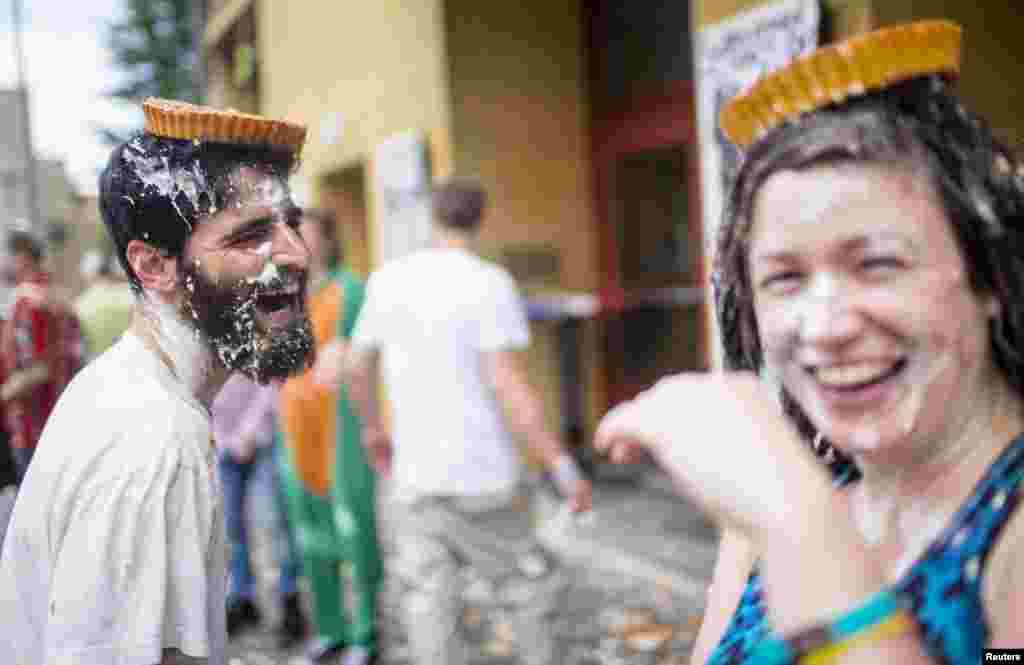 People attend a pie fight in Berlin, Germany. The event was organized by a movie theater as part of an opening for a 10-day retrospective of the comedians Stan Laurel and Oliver Hardy.