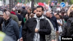 FILE - Alexandre Benalla, French presidential aide, is seen during the May Day rally in Paris, France, May 1, 2018. 