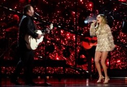 Lee Brice, left, and Carly Pearce perform at the 56th annual Academy of Country Music Awards on April 18, 2021, at the Grand Ole Opry in Nashville, Tenn.