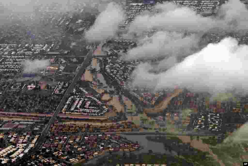 A section of Scottsdale, Arizona appears flooded following heavy rains that left motorists stranded during their morning commute, Sept. 8, 2014.